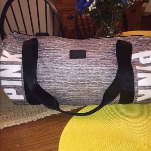 USED PINK DUFFEL BACK PRICE REFLECTS